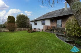 Maison avec garage et jardin