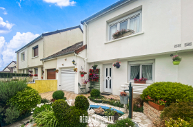 Maison avec garage et jardin