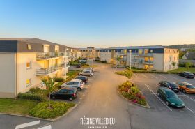 Appartement en résidence avec balcon et parking