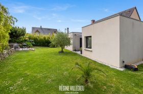 Maison avec garage et jardin